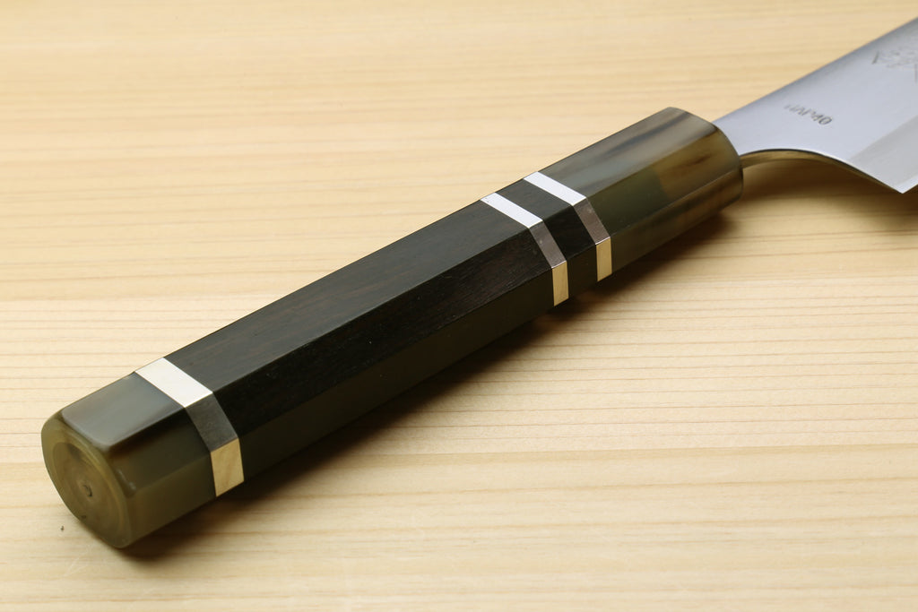 Petty chef knife handle end with dark triple-ring grip and white blade