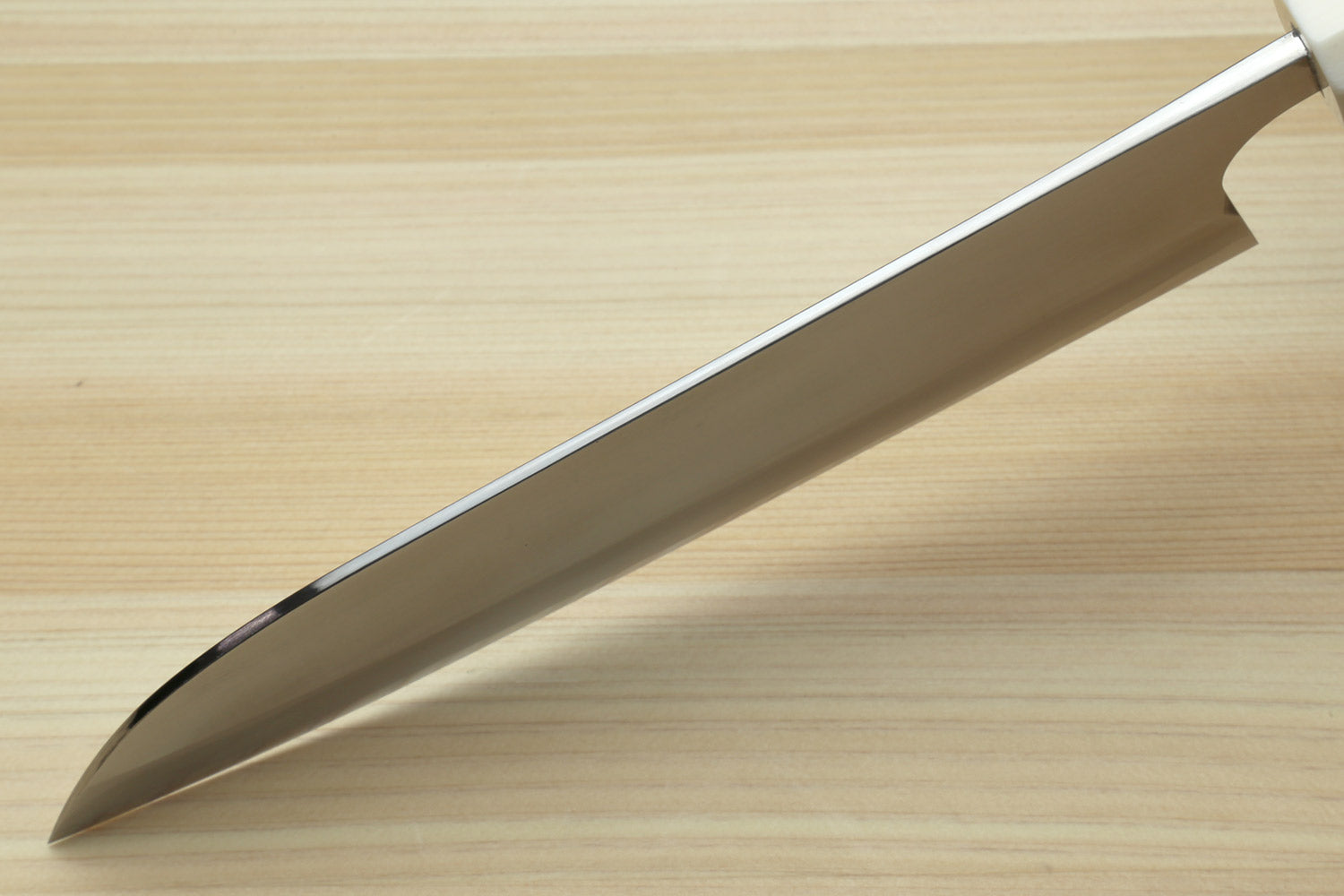 Santoku chef's knife curved edge and reflective blade