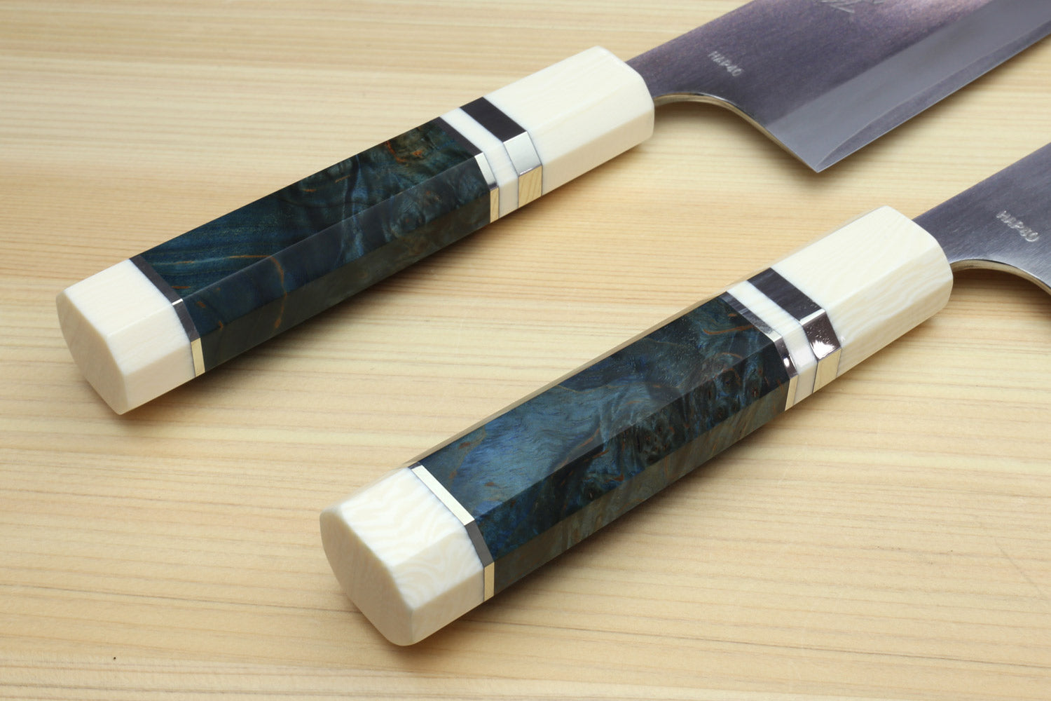 Santoku chef's knife pair: dark blue patterned handle and ivory bolster