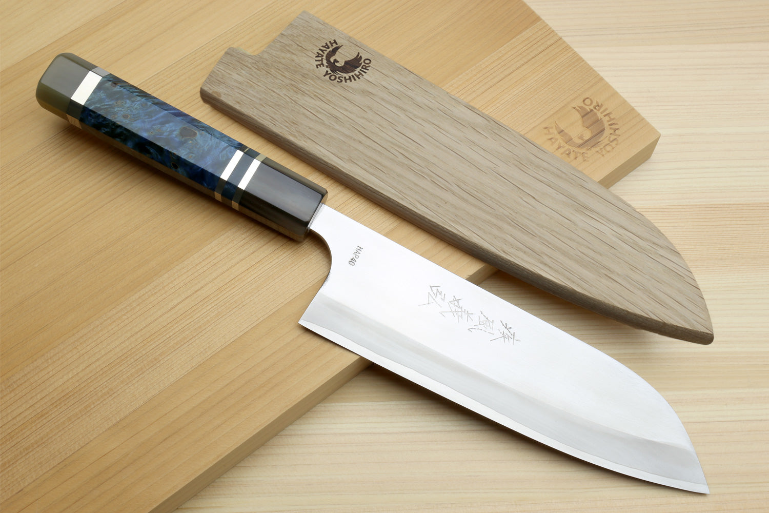 Santoku chef's knife with blue ocean-pattern handle and white HAP40 steel blade