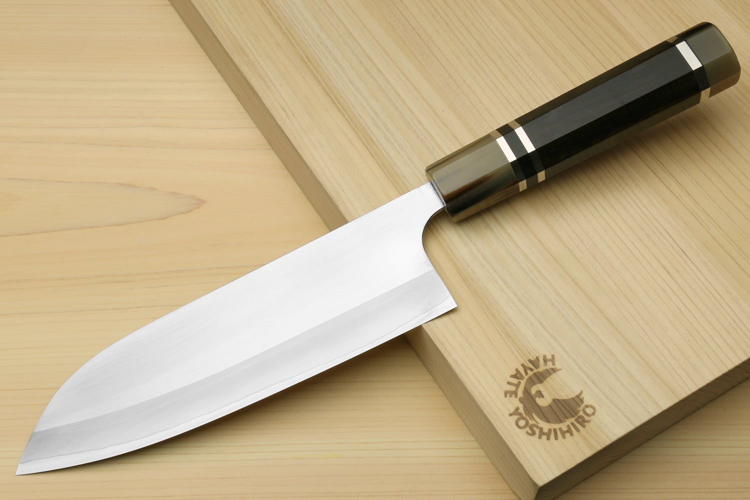 Santoku chef knife with ebony octagonal handle and long blade, with wooden saya