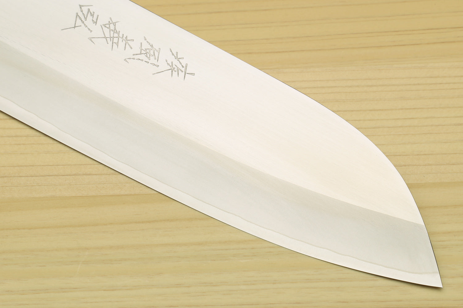Santoku knife blade close-up with HAP40 steel and laser-etched marks