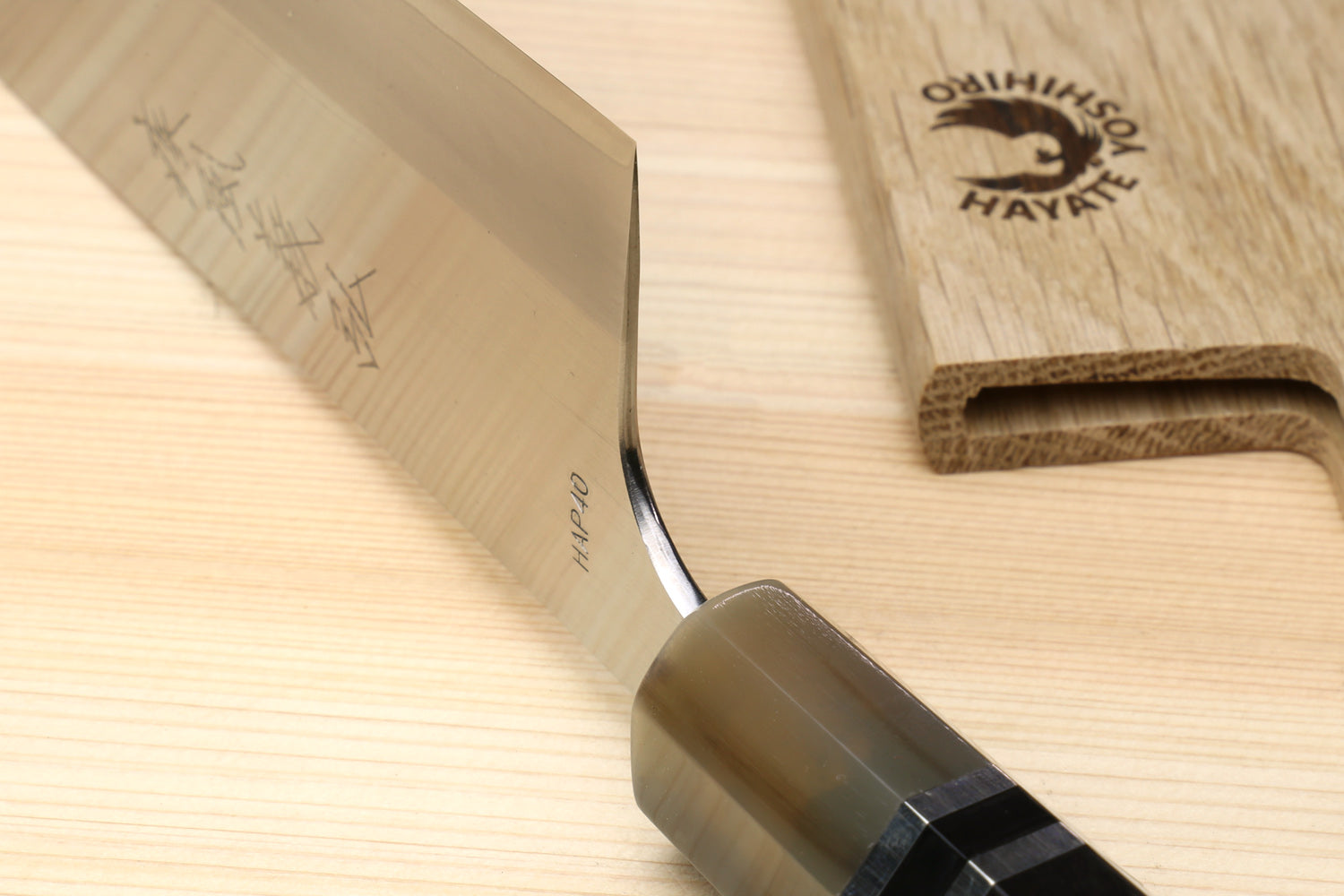 Santoku knife with ebony octagonal handle and triple-ring ferrule, angled blade