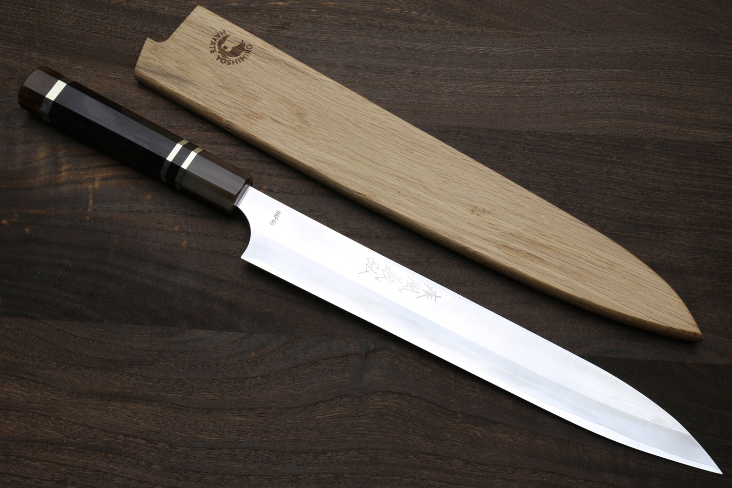 Sujihiki slicer knife with silver blade, dark ebony triple-ring handle, wooden saya cover