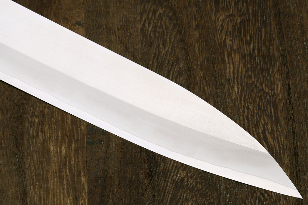 Sujihiki slicer blade with smooth white finish and sharp pointed tip