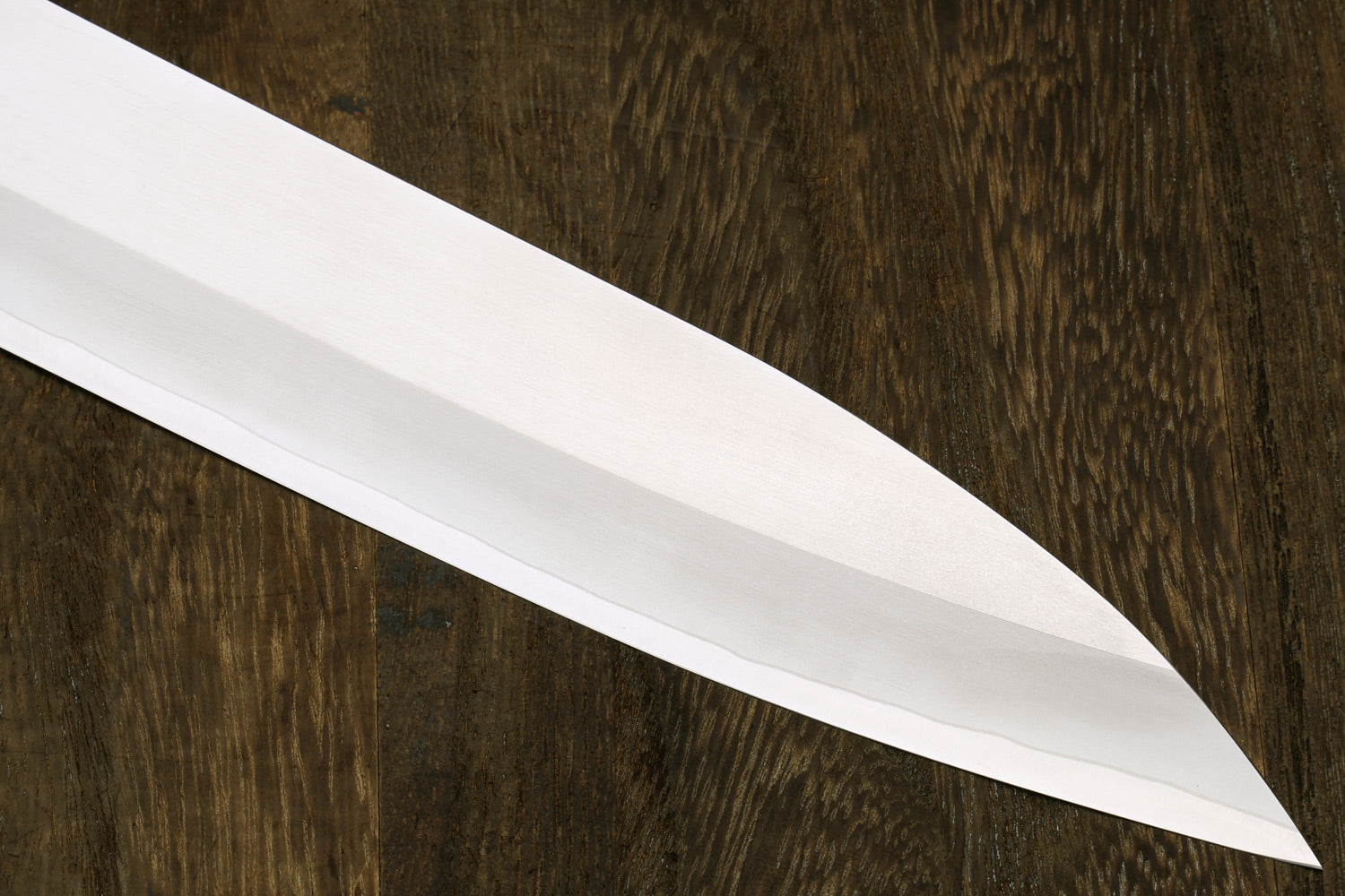 Sujihiki slicer blade with smooth white finish and sharp pointed tip