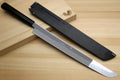 Japanese kitchen knife set with silver blade and two dark sheaths on wooden base