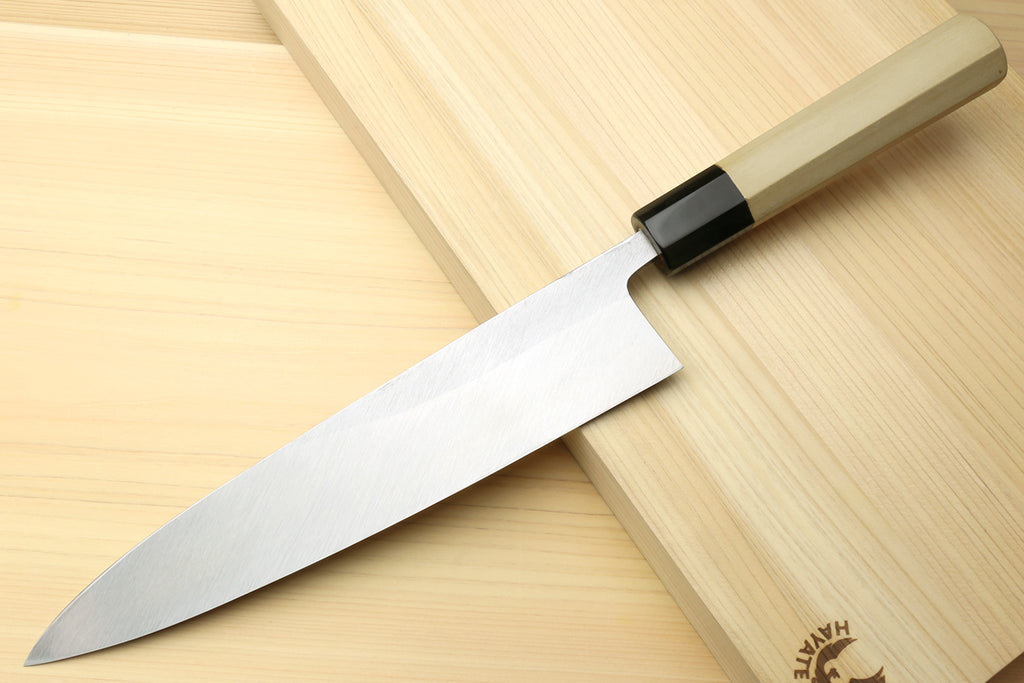 Japanese chef knife for sushi and sashimi, silver blade with black bolster and light wood handle
