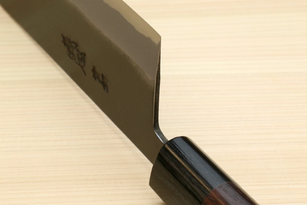 Nakiri knife tip and spine view with rounded cutting corner and dark wood handle