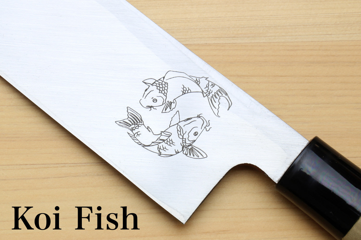 Koi fish engraving on metal blade segment with black handle