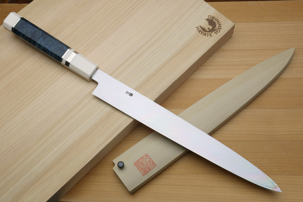 Left-handed yanagi sushi knife with mirror blade, ivory handle, and blue patterned accents