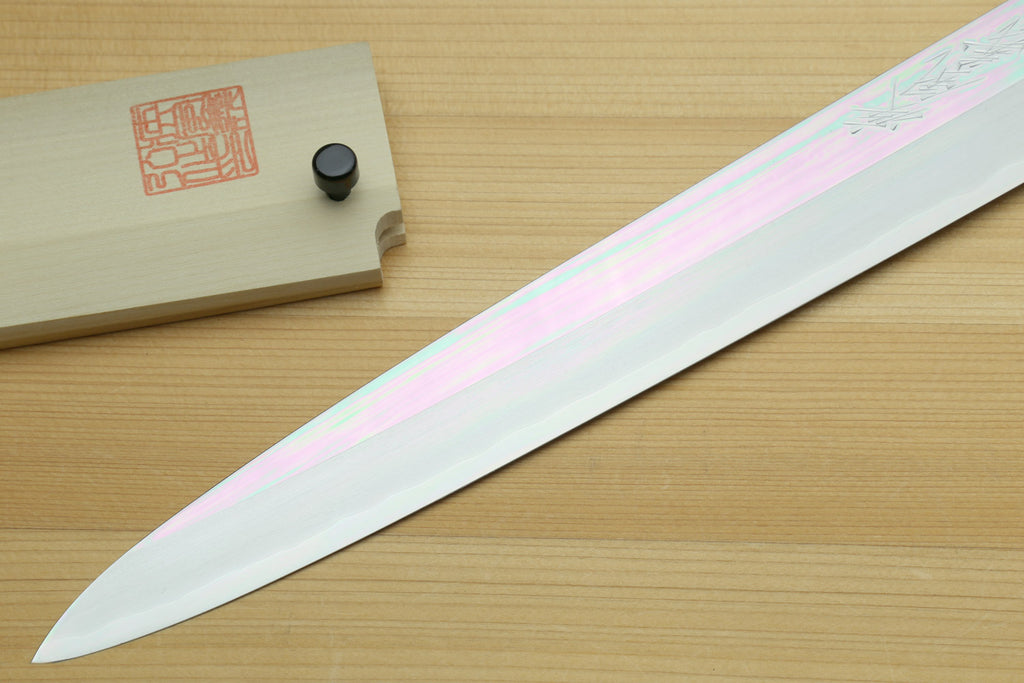 Left-handed yanagi slicing knife with long white steel blade and pale ivory bolster