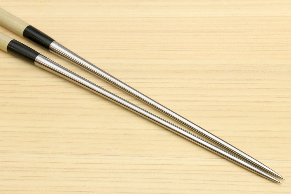 Two sushi tweezers with light wood handles and stainless steel pointed ends