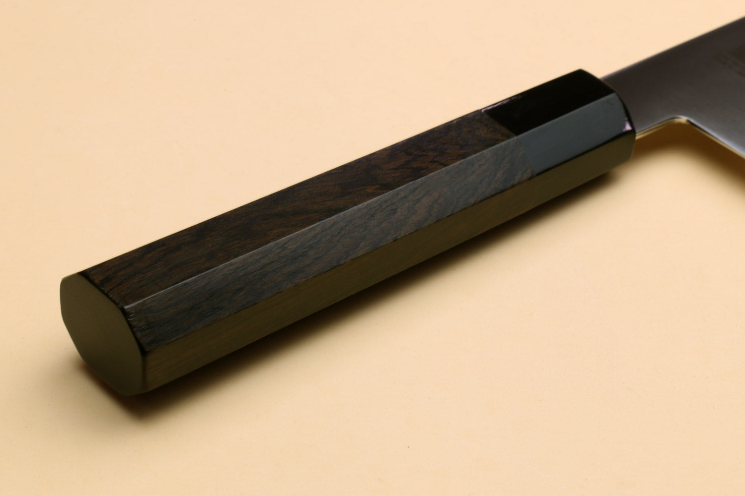 Ebony handle block with stainless spine and dark bolster section