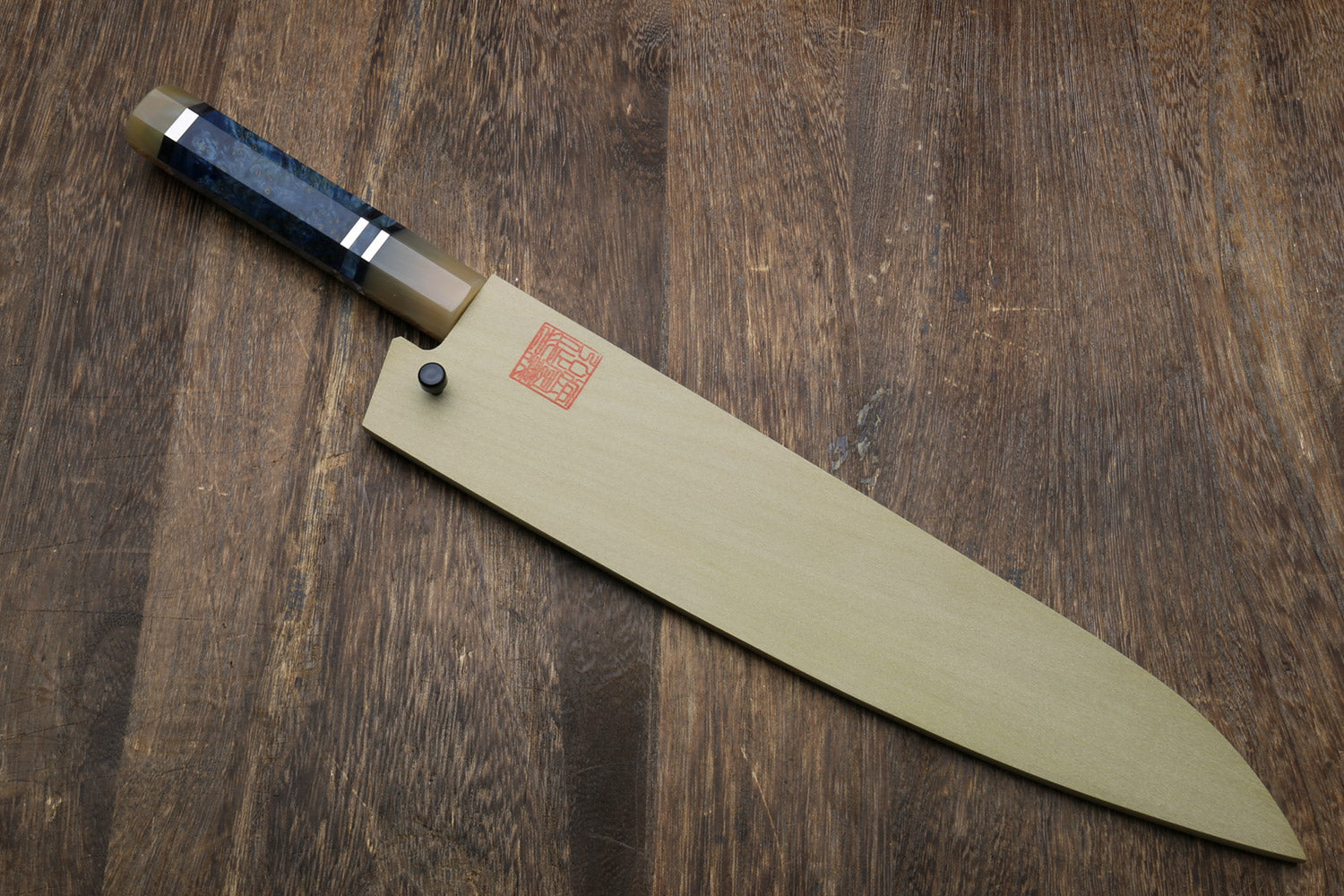 Gyuto chef knife with ocean blue handle and stainless blade with saya