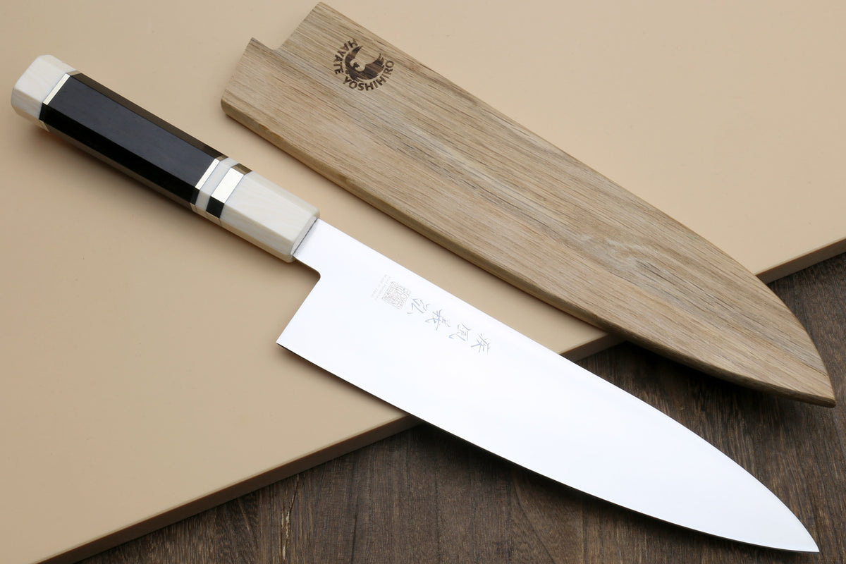 Stainless steel Japanese gyuto knife with ebony handle and ivory bolster
