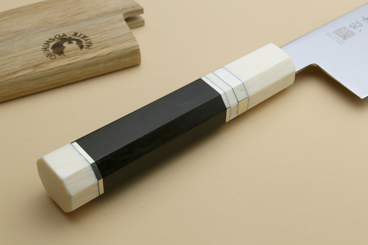 Japanese gyuto knife handle detail with ivory bolster and dark ebony grip