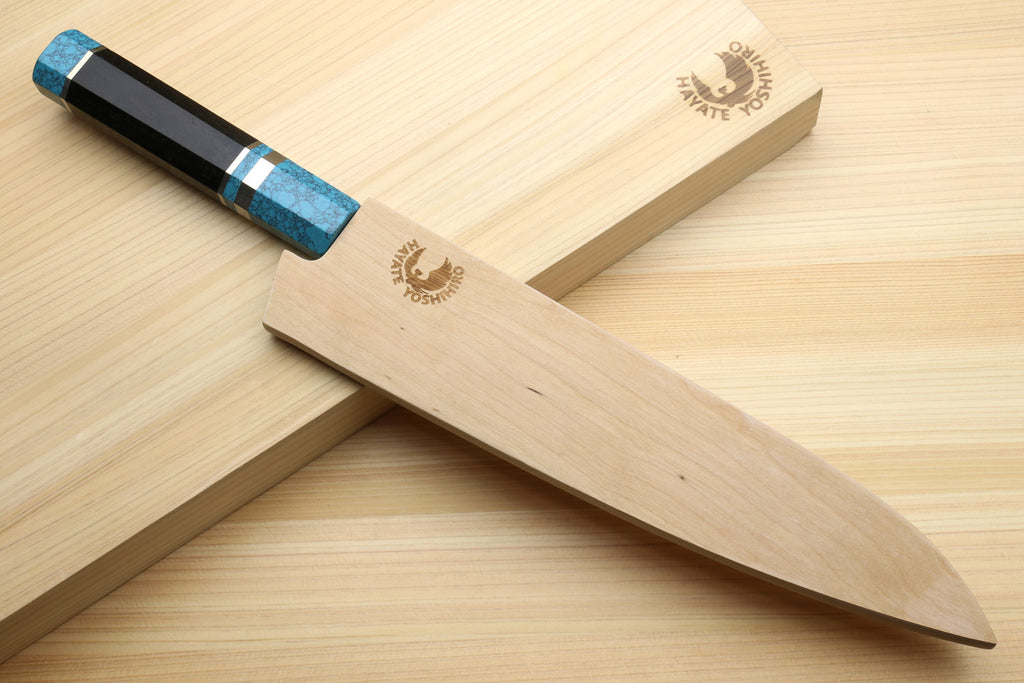 Stainless steel gyuto chef knife with turquoise blue handle and wooden sheath