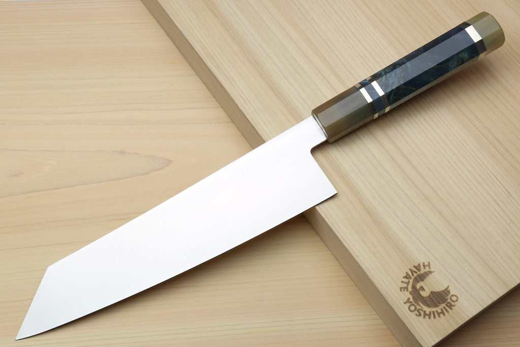Kiritsuke chef knife with ice-hardened stainless blade and ocean blue handle, metal bolster