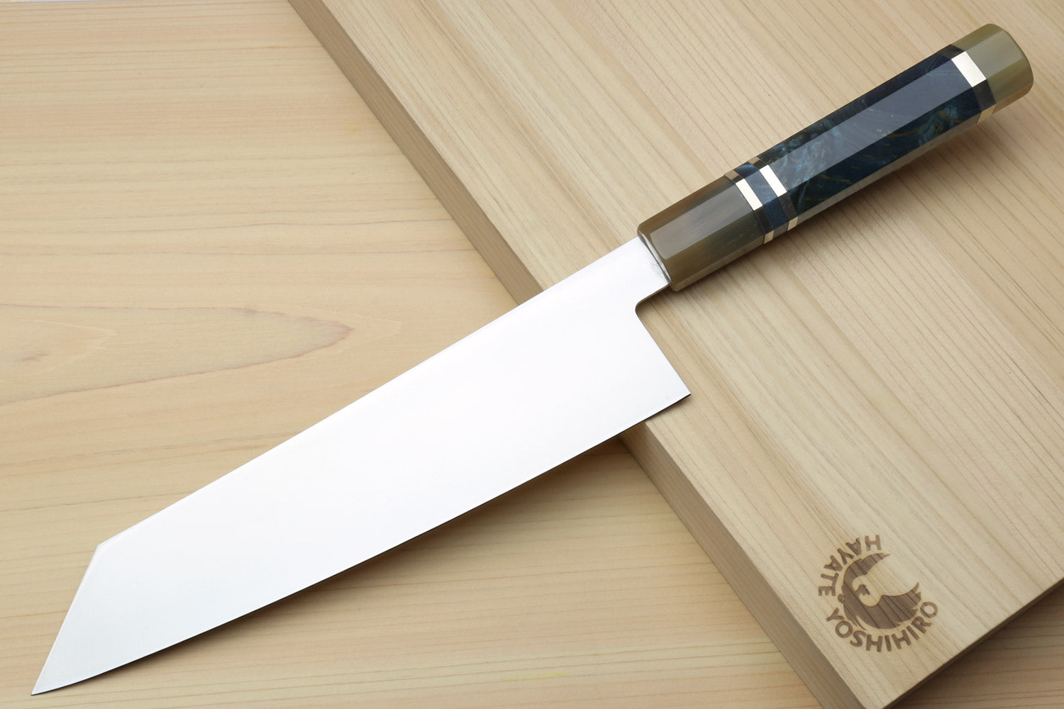 Kiritsuke chef knife with ice-hardened stainless blade and ocean blue handle, metal bolster