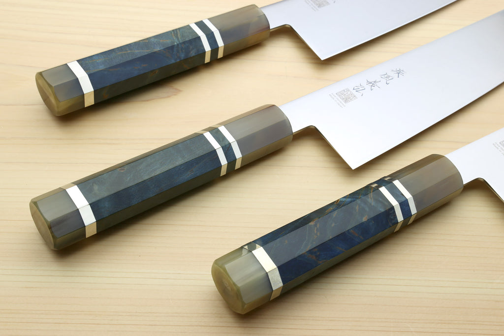 Kiritsuke chef knives with ocean blue handles, white wrap stripes, and stainless blades