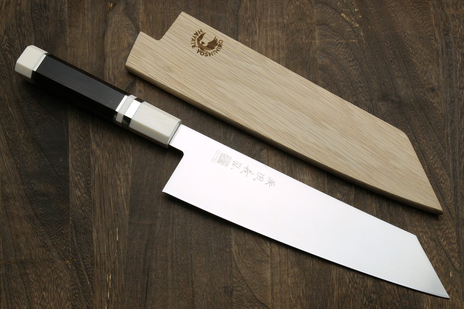 Kiritsuke chef knife with sheath, stainless blade, ebony handle and ivory accents.