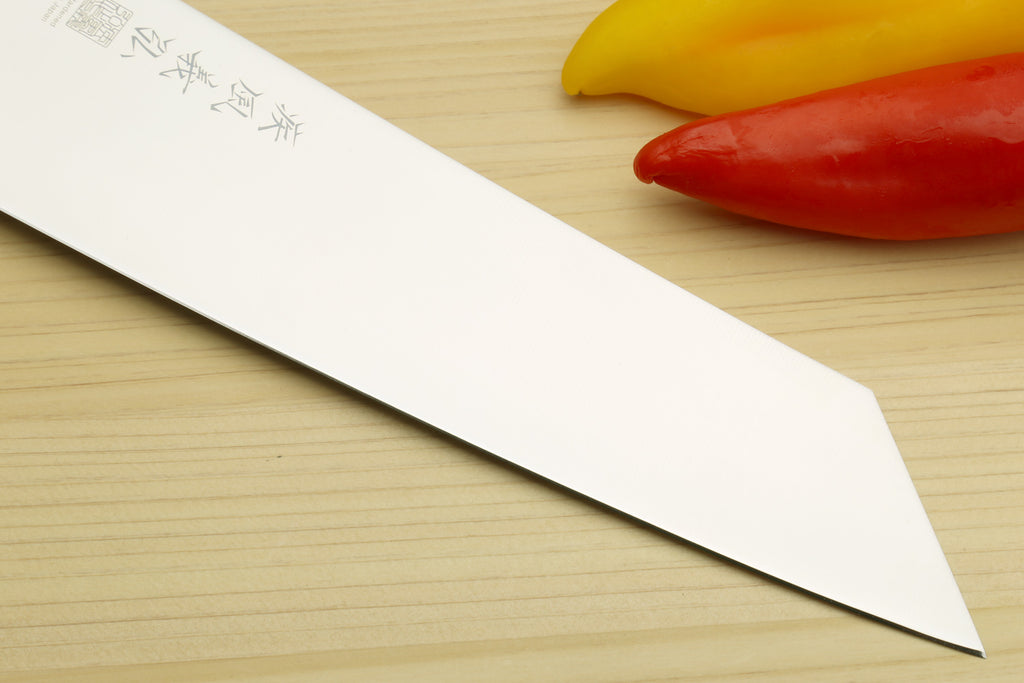 Kiritsuke chef knife blade close-up: stainless steel with etched markings