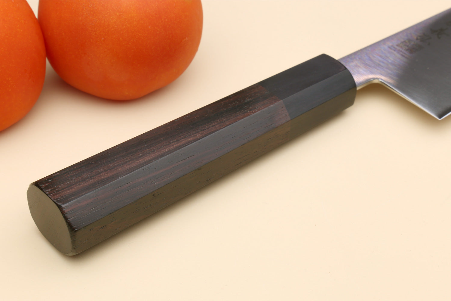 Chef knife with stainless kiritsuke blade and dark rosewood handle, side view