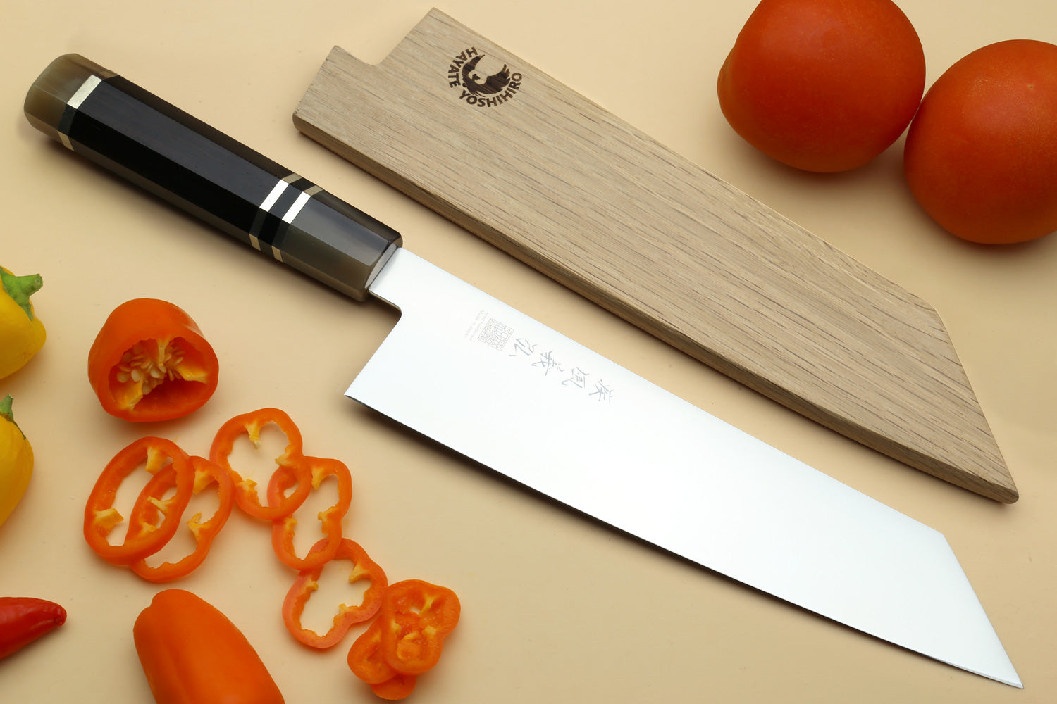 Kiritsuke chef knife showing full blade and ebony triple-ring handle
