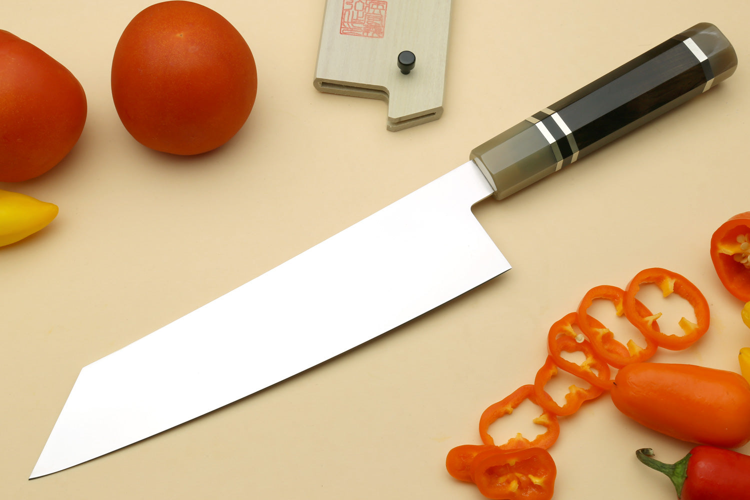 Stainless kiritsuke chef knife with dark ebony triple-ring bolster and blade