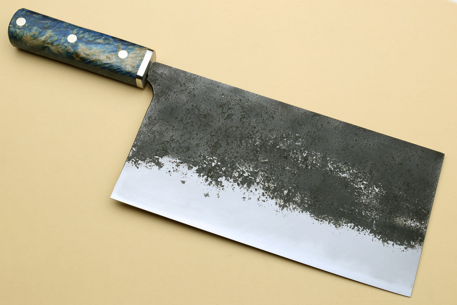 Chinese-style vegetable cleaver knife with blue speckled handle and broad chopping blade