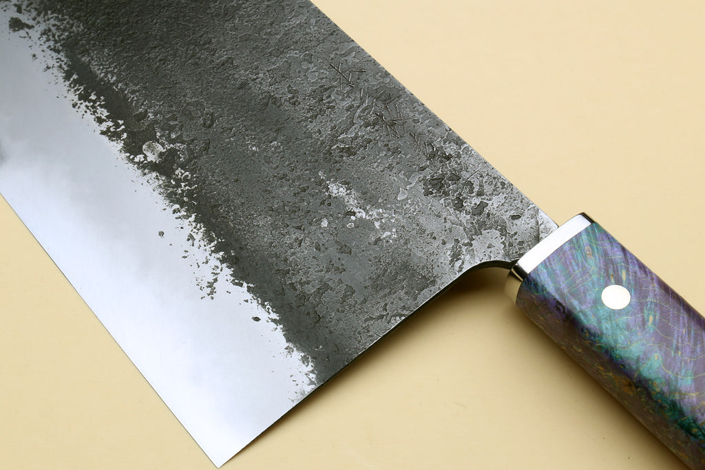 Chinese-style cleaver knife, wide dark mottled blade with iridescent purple-blue handle