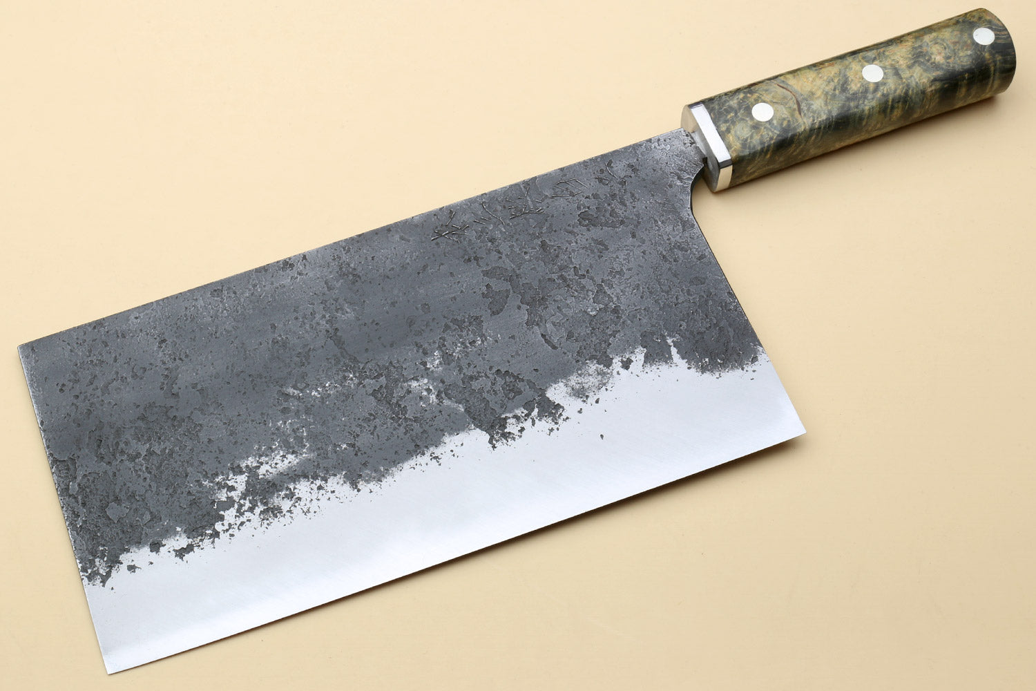 Chinese-style vegetable cleaver knife with speckled dark steel blade and burl handle