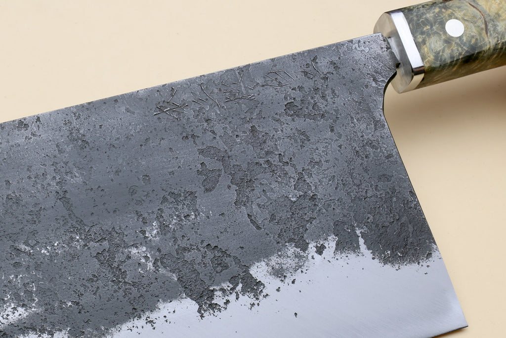 Chinese-style vegetable cleaver knife with mottled dark steel blade and burl grip