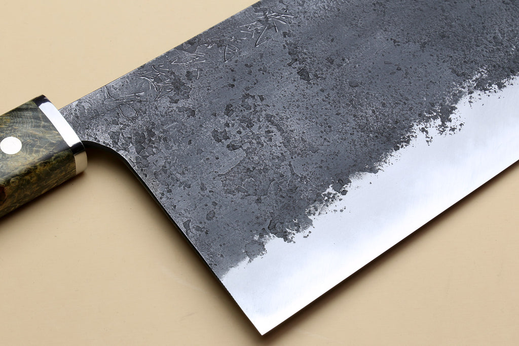 Chinese-style cleaver knife with angled view of speckled silver blade