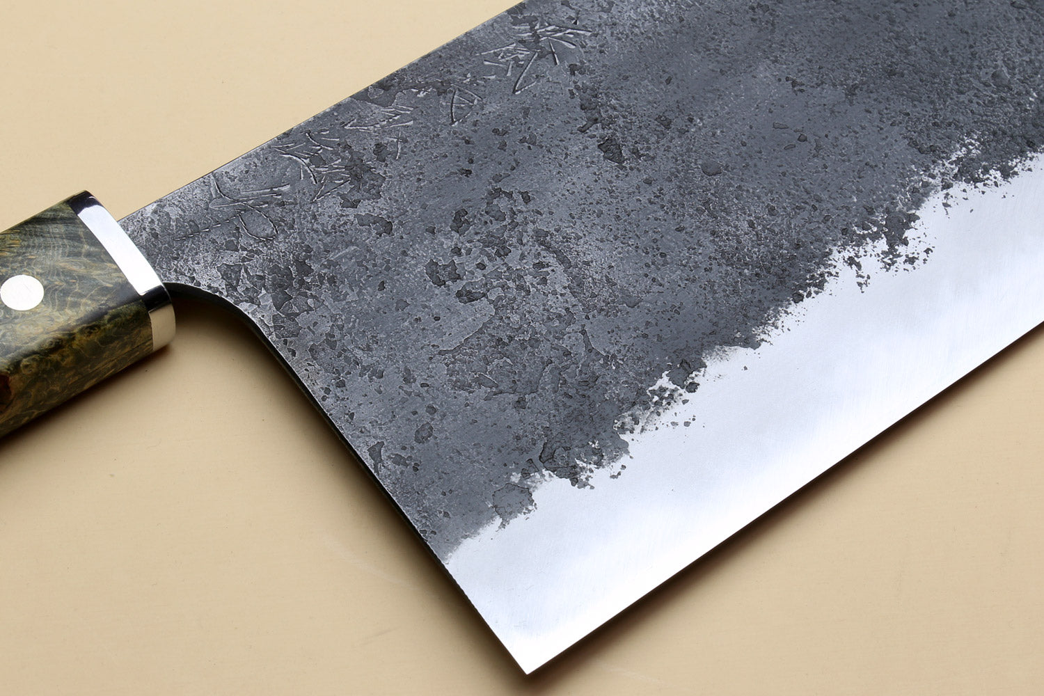 Chinese-style cleaver knife with angled view of speckled silver blade