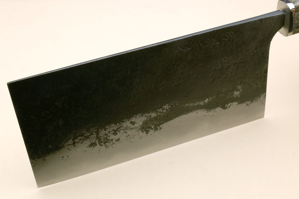 Chinese-style cleaver knife with flat side view of speckled silver blade