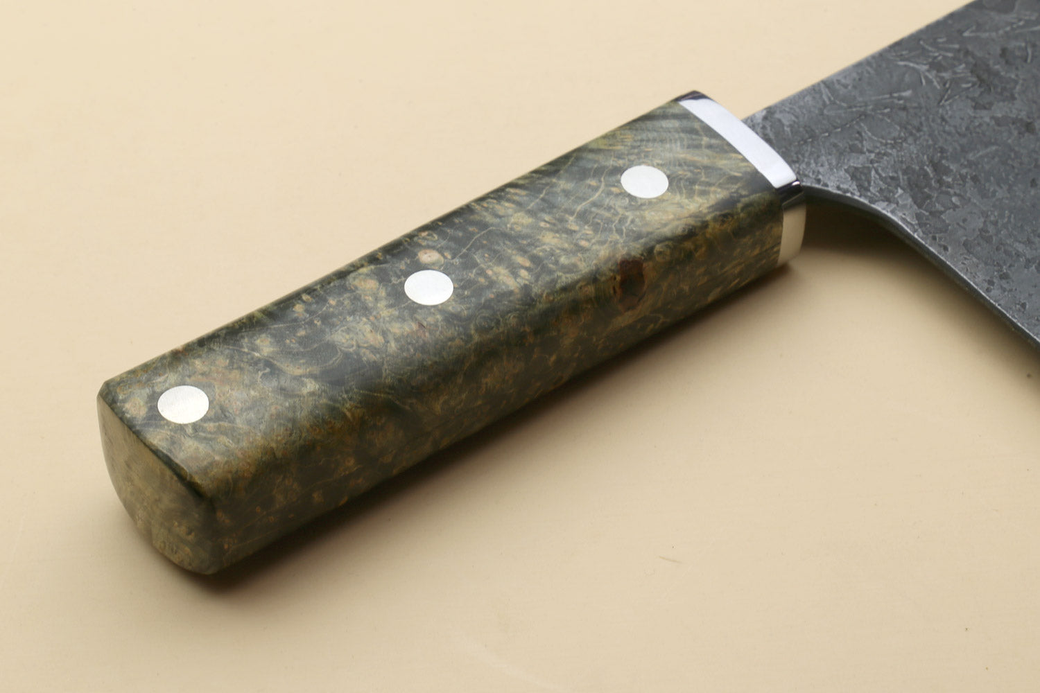 Chinese-style cleaver knife with dark burl-style wood handle and silver blade edge