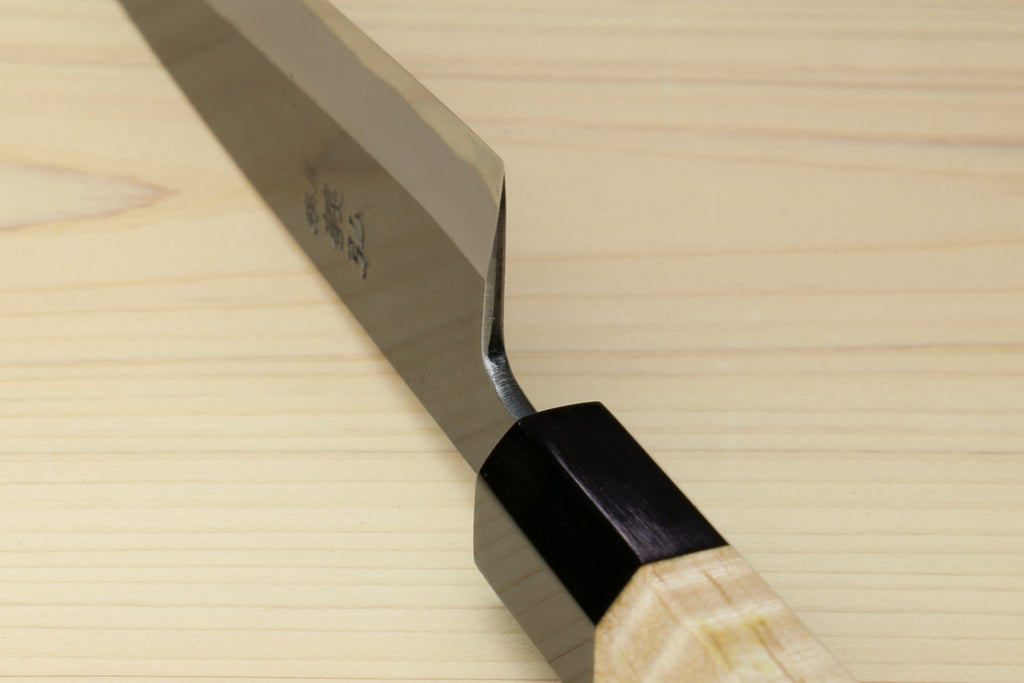 Petty utility knife with dark blade and light wood handle, black bolster at the tang