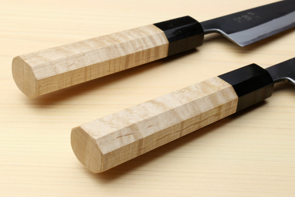 Petty utility knives with light wood handles and dark black bolster, side-by-side