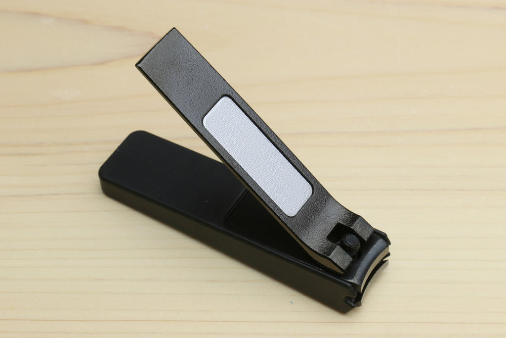 Black Japanese nail clipper with open finger guard