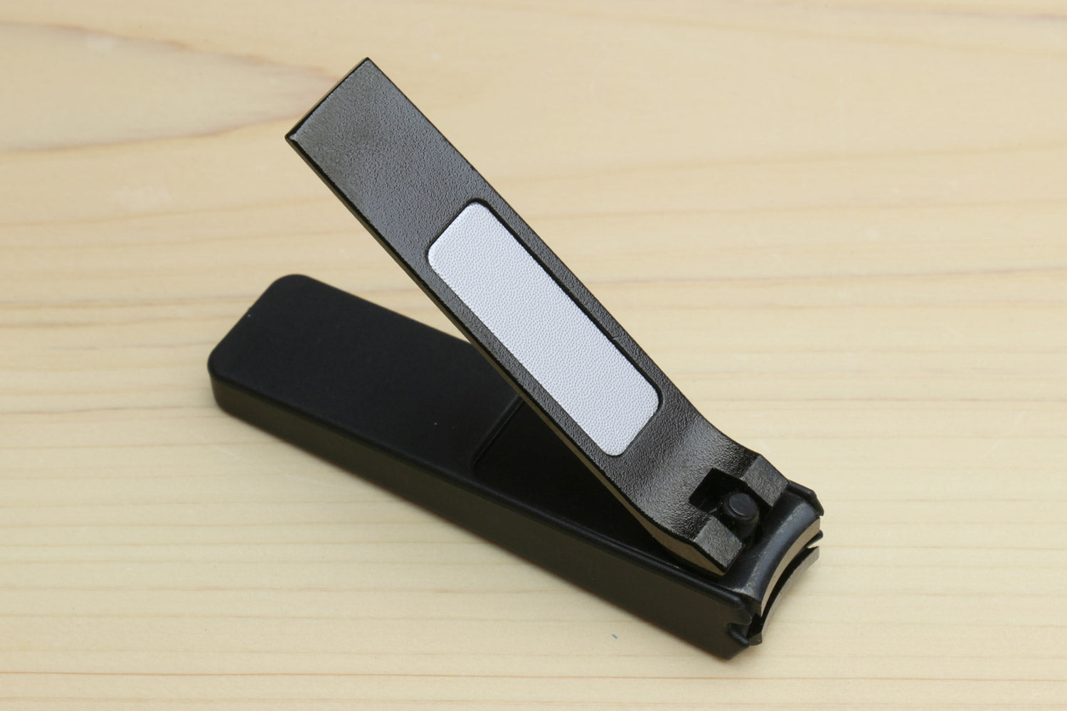 Black Japanese nail clipper with open finger guard