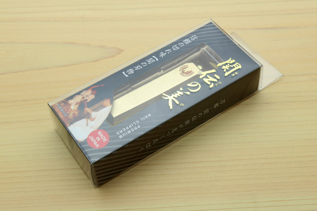 Yoshihiro nail clippers box packaging with printed gold and dark design.