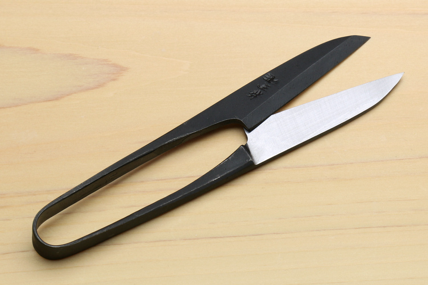 Japanese sewing snip scissors with black handle and silver blade