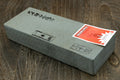 Natural sharpening whetstone, rectangular gray stone with stamped markings and label