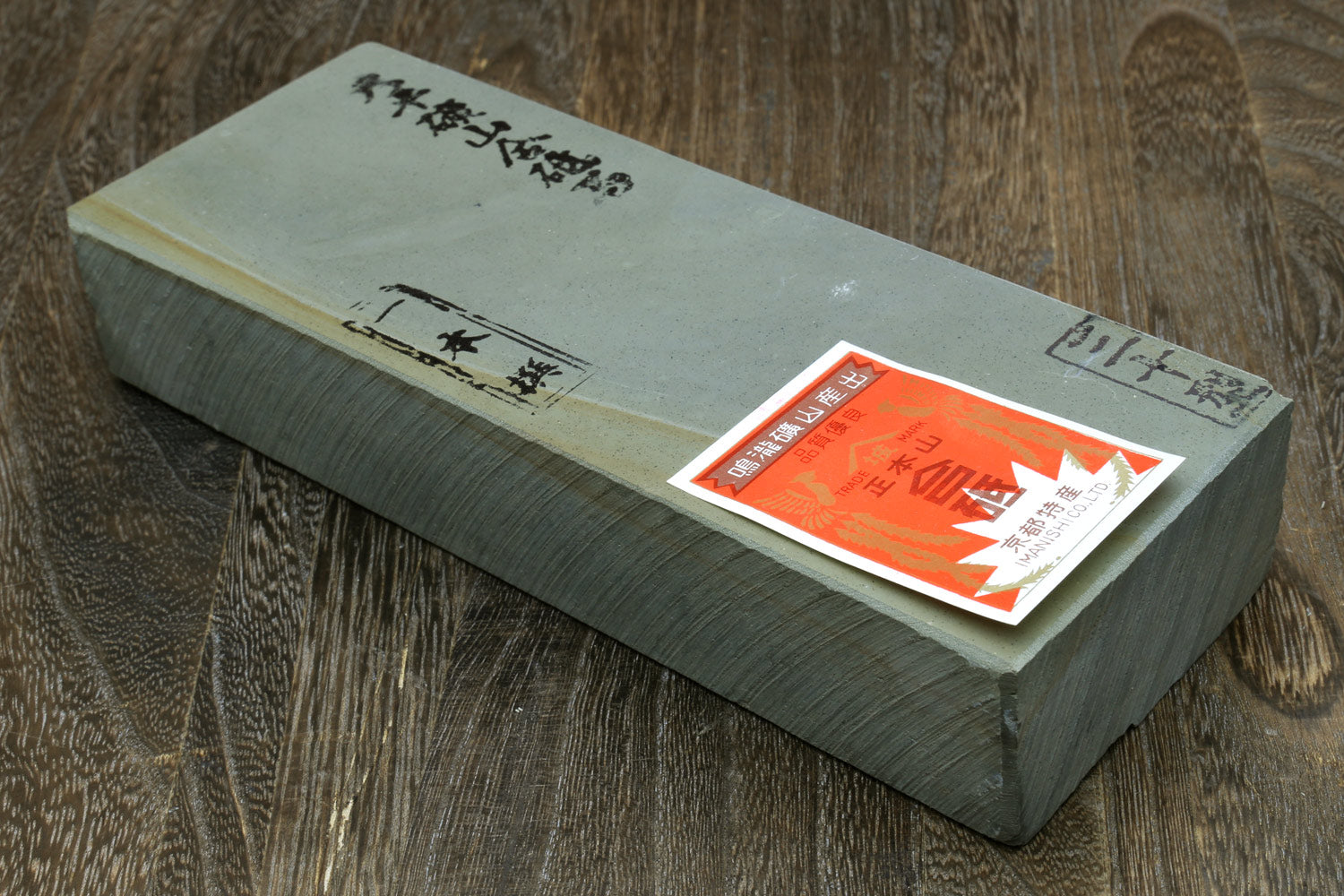 Rectangular sharpening whetstone with label on top
