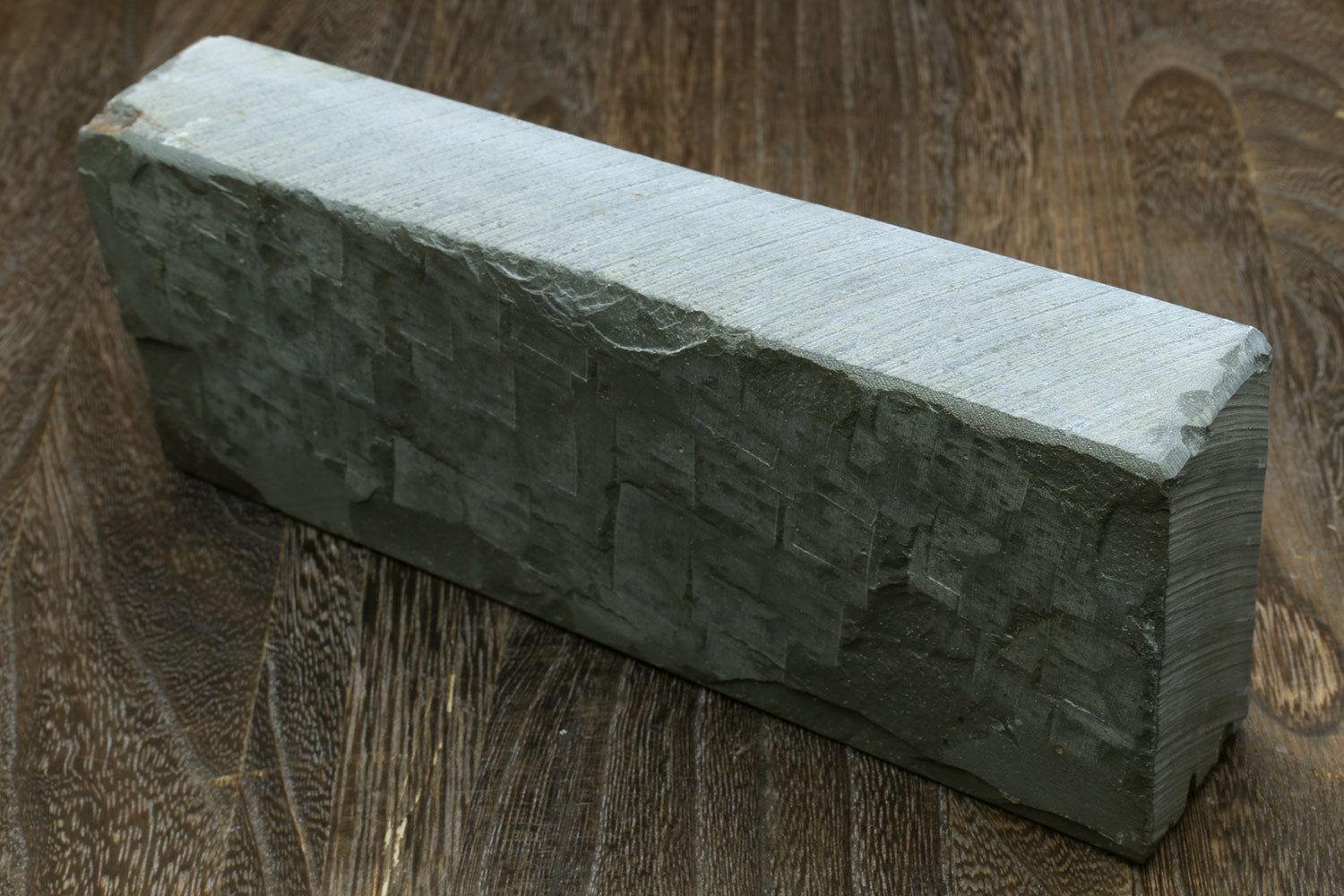 Long rectangular whetstone with pale top and dark sides