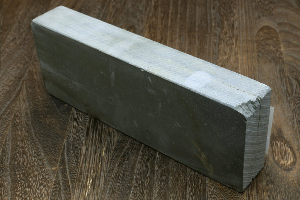 Rectangular natural whetstone block, dark gray-green side view