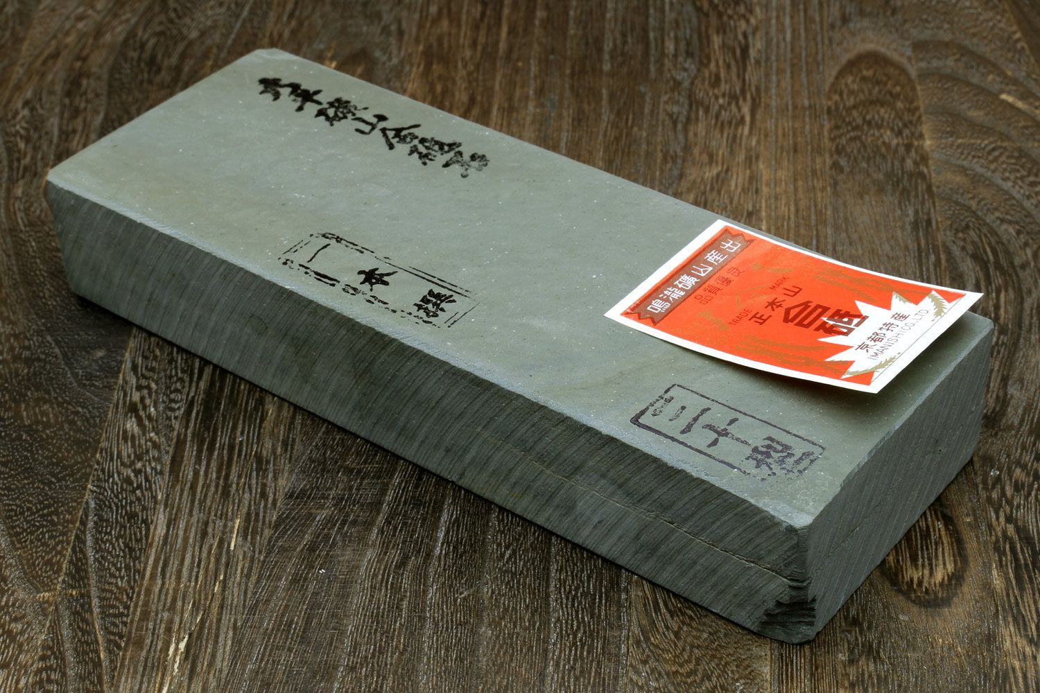 Natural sharpening whetstone block, light green with paper label on top