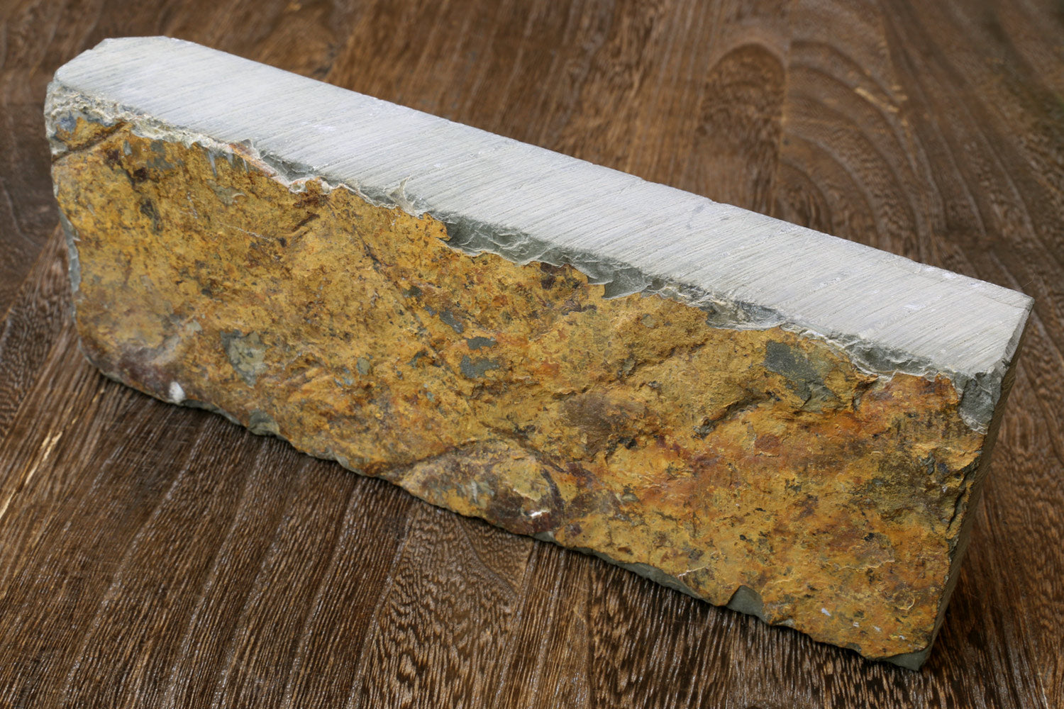 Sharpening whetstone, yellow speckled rectangular block with white side edges